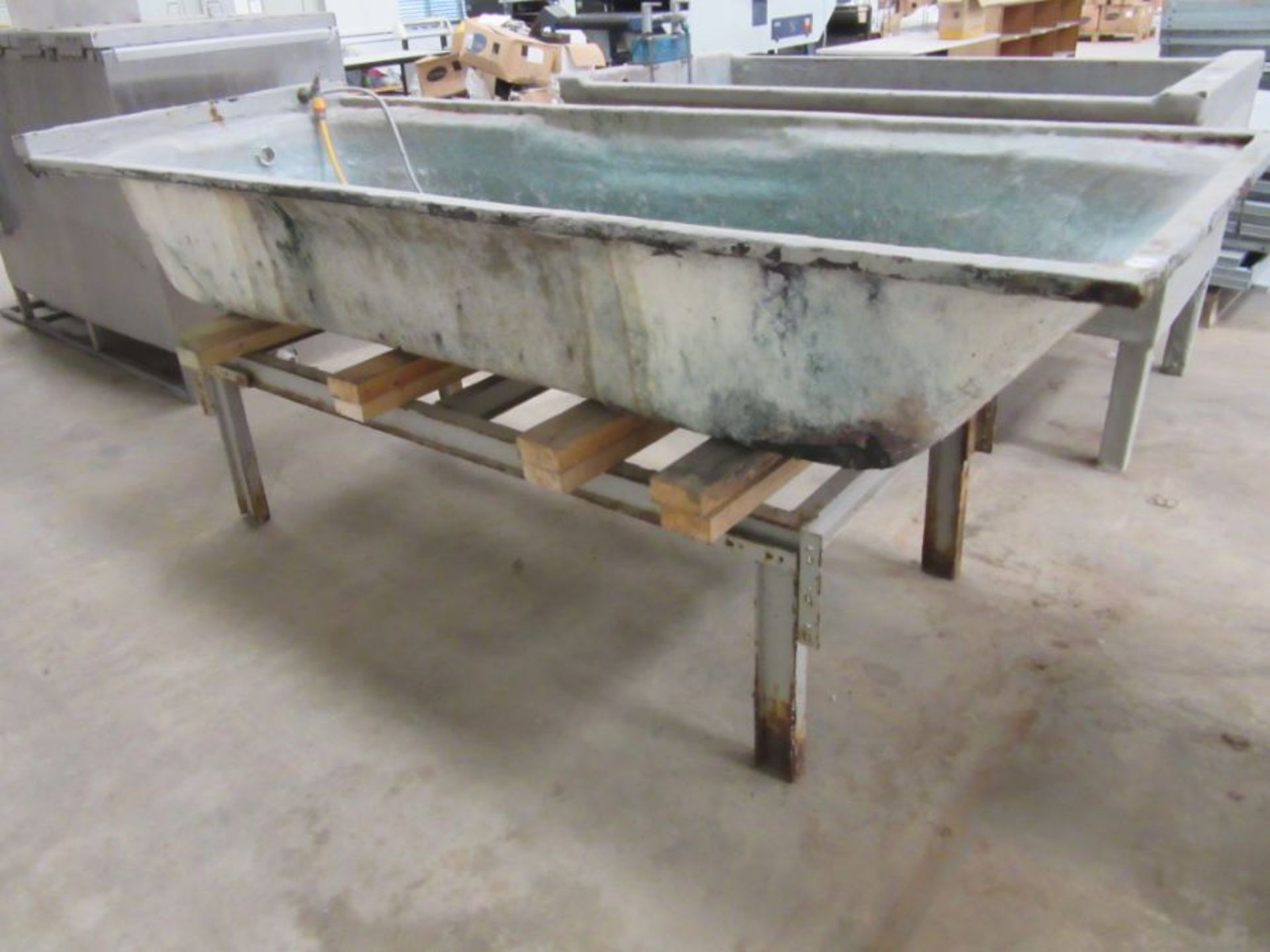 A fibreglass bath for dyeing clothes