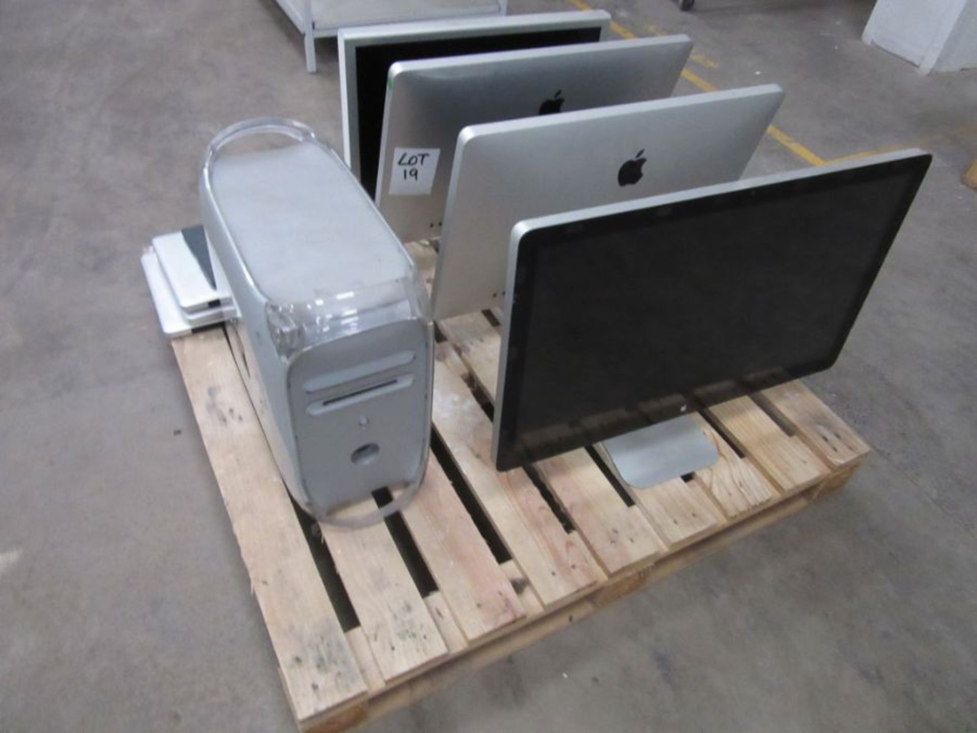 A collection of Apple computer items including monitors,3 laptops, ipad, tower etc