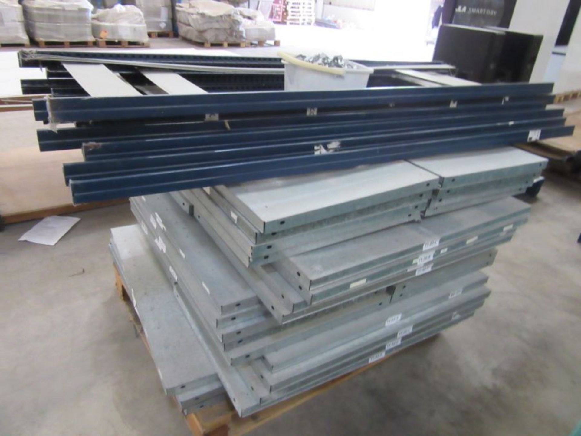 A large quantity of metal racking with fixings