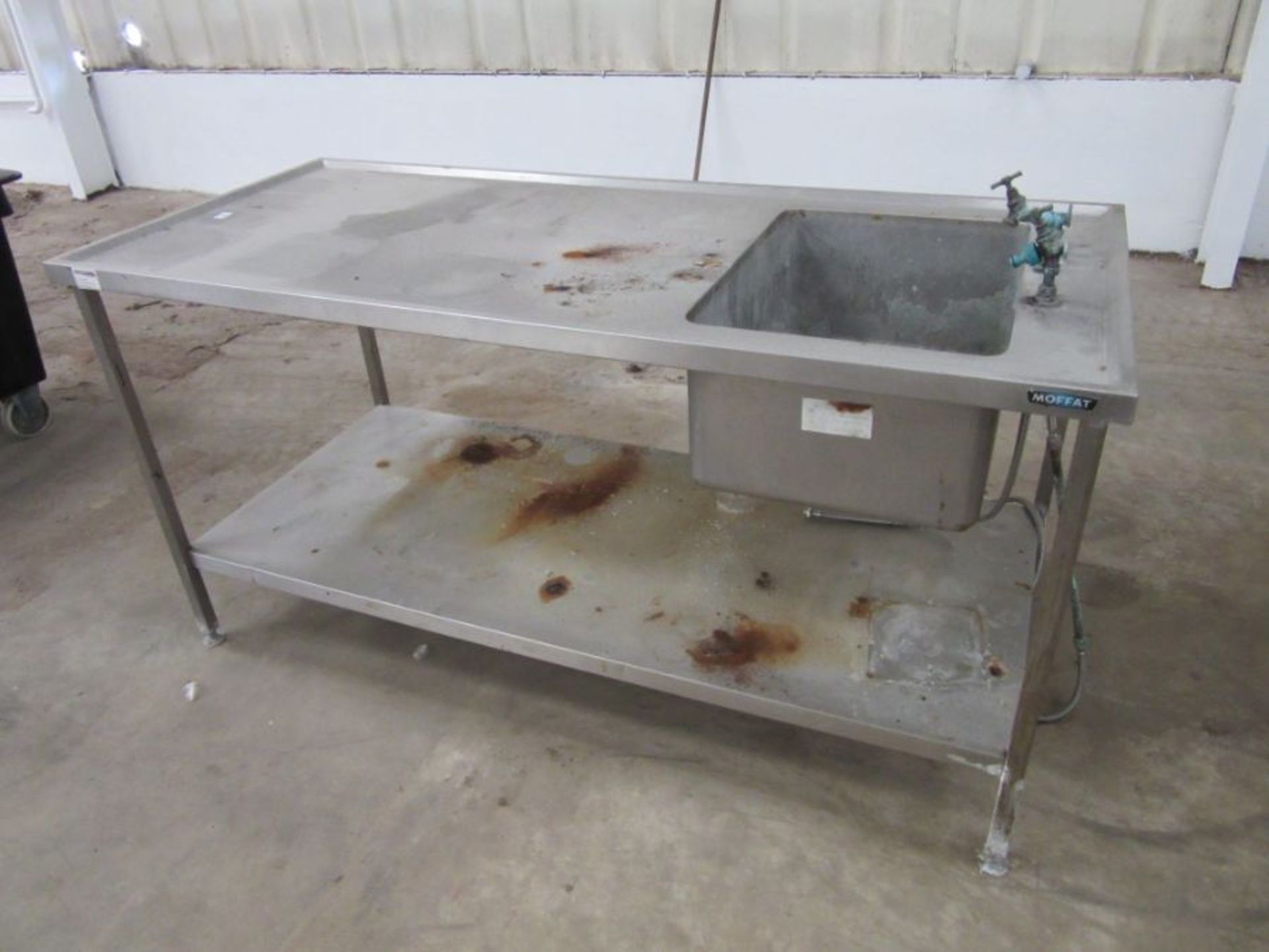 An industrial stainless steel sink unit