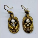 A pair of Victorian gold (tests as 15ct) earrings set with paste