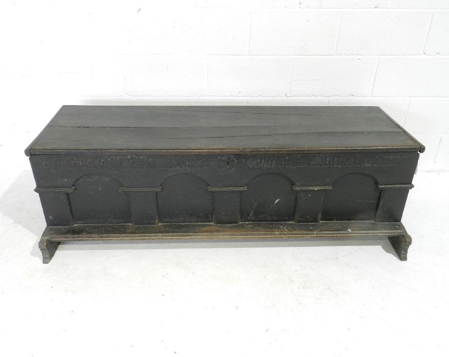 A German marriage coffer with Gothic style writing to arched front, dated 1840. one leg A/F