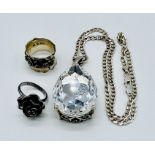 A 925 silver necklace and pendant set with a large clear tear drop shaped stone along with two