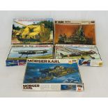 A collection of five vintage boxed plastic model construction kits including a Hasegawa Hales German