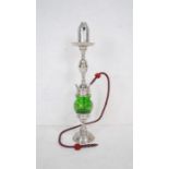 A hookah pipe along with a converted brass oil lamp with spherical glass shade