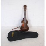 A Paisen rosewood four string ukelele with strap and soft carry case