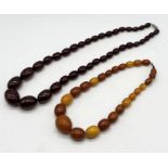 An amber necklace (weight 29.5g) along with a cherry amber coloured necklace