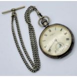 A hallmarked silver pocket watch by Waltham with subsidiary second hand on a silver plated Albert