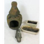 A well weathered vintage chimenea, two bonsai pots and an ornamental duck