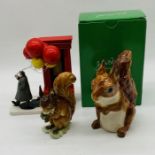 A boxed John Beswick red squirrel money box, along with "The Dream Seller" figurine by Berit