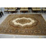 A large beige ground Keshan style carpet - approx. 13.7ft x 9.7ft