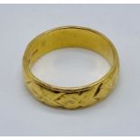 An 22ct gold wedding band, weight 6.7g