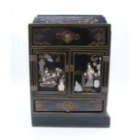 A Japanese lacquered cabinet with ornate hardstone decoration - length 29cm, height 41cm