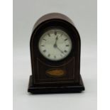 An Edwardian inlaid clock with shell decoration