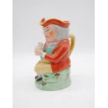 A 19th century Staffordshire toby jug - height 24cm