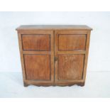 A Victorian mahogany two door cupboard with inlaid detailing - length 113cm, depth 35cm, height