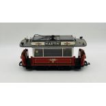 An unboxed Lehmann LGB G gauge model railway Martini passenger trolley tram with two passengers (