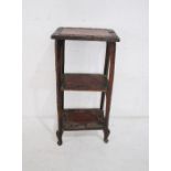 A turn of the century three tier whatnot with carved decoration - height 89cm