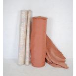 Two vintage rolls of fabric along with one roll of upholstery fabric