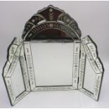 A venetian style tryptic mirror with cut detail to glass.