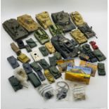 A collection of various built plastic army tank models etc