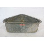 A galvanised corner feeding trough.