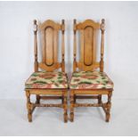 A pair of oak hall chairs, with pegged joints.