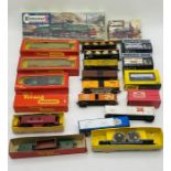 A collection of model railway OO gauge rolling stock and wagons including two boxed Tri-ang Hornby