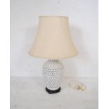 A modern ceramic lamp with pierced decoration - total height 72cm