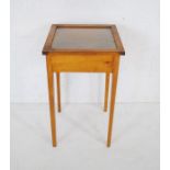 An oak bijouterie table raised on tapered legs - length 42cm, depth 41cm, height 71.5cm