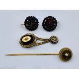 A small collection of Victorian gold jewellery including a stick pin, pair of garnet earrings etc.(