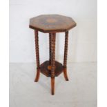 A small octagonal occasional table with inlaid style decoration, raised on bobbin turned legs -