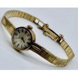 A ladies Smiths 9ct gold wristwatch with 9ct gold strap, total weight including movement 22g
