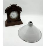 A vintage enamel light shade along with a wooden cased Ansonia Clock Co. mantle clock
