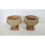 A pair of weathered reconstituted stone garden urns - diameter 38cm, height 33cm