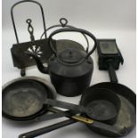 An assortment of vintage kitchenalia including a cast iron kettle, copper pans , carriage lamp etc.