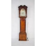 A Georgian oak longcase clock with inlaid detailing and painted dial named to 'E. Mathews,