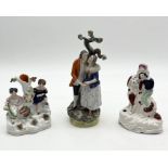 Three Staffordshire pottery figure groups including spill vase, child with spaniel etc.