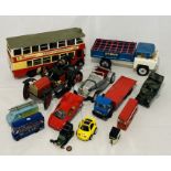 A collection of unboxed toy and model vehicles including a Tri-ang Hi-Way tipper truck, limited