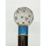 A rock crystal, turquoise, gold and enamel parasol handle, the ball top with etched flowers above