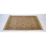 An Eastern style beige ground rug - 178cm x 120cm