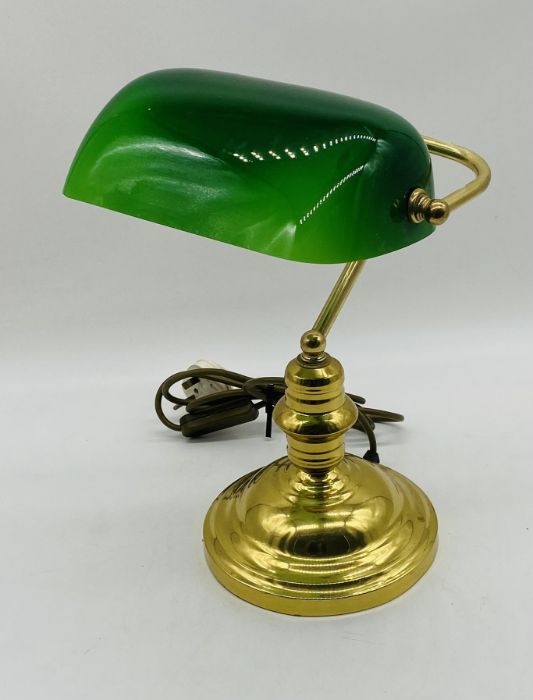 A vintage bankers lamp with green shade