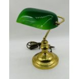 A vintage bankers lamp with green shade