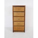 A wicker chest of five drawers with glass top - length 50cm, depth 46cm, height 110cm