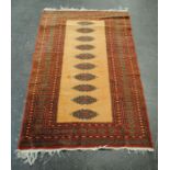 An Eastern red ground rug - 158cm x 97cm