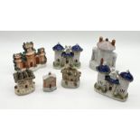 A collection of Staffordshire pastille burners in the form of churches, houses, castles etc.
