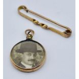 A 9ct gold brooch (1.8g) along with a 9ct gold double side photo pendant