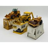 A boxed NZG Case W20C Wheeled Loader (1:35 scale), along with boxed Conrad Massey Ferguson 50B