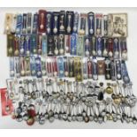 A large collection of souvenir and commemorative spoons