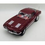 An unboxed Chevrolet Corvette Stingray (1:8 scale) plastic car model in maroon.